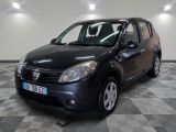 a picture of a small black car parked on a checkered floor