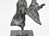 statue of a man and woman holding hands on a black base