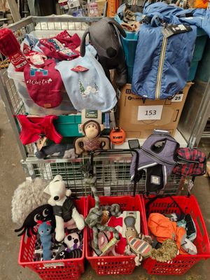 a cart full of stuffed animals and other items