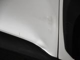 a close up of a car ' s front bumper and fender