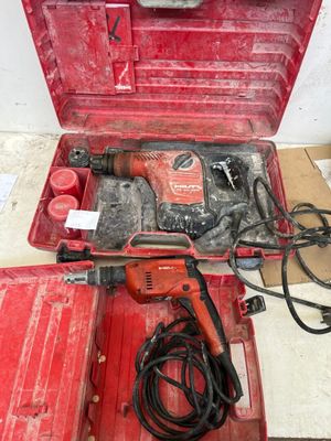 a red tool box with tools in it on the floor