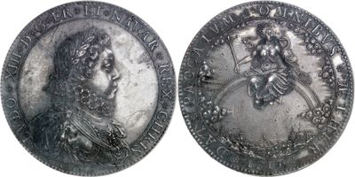 deux pièces d'argent sur lesquelles figurent les portraits d'un homme et d'une femme