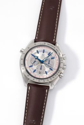 an image of a close up of a watch on a white surface
