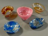 five different types of glass bowls on a table