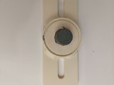 a close up of a toilet seat with a button on it