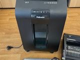 an image of a printer and a mouse on a wooden floor