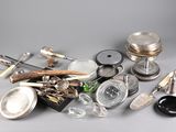 a pile of silver objects on a gray surface