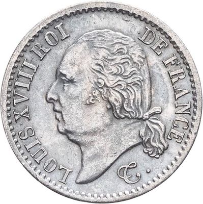 une vieille pièce d'argent portant une tête de femme