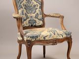 an image of a chair with a blue and white upholstered seat
