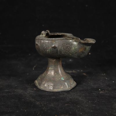 a small metal object that is on a black surface