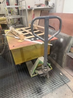 a machine that is working on a piece of wood