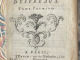 an old book with writing on it sitting on top of a table