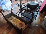 a wooden cart with a trunk on it in the middle of a room