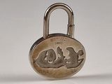 a silver padlock with a picture of two cats on it