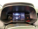 the dashboard of a car with a digital display in the center