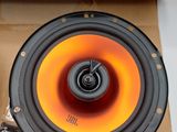 a speaker that is sitting on top of a cardboard box