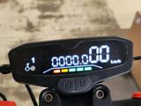 a digital clock on the handlebar of a bike