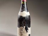 a bottle of wine with a map of the world on it