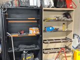 a room that has a shelf with tools on it