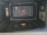 a close up of a microwave with food inside of it