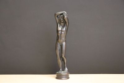 statue of a man holding his head in his hands
