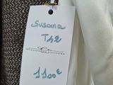 a label on a suit hanging on a hanger