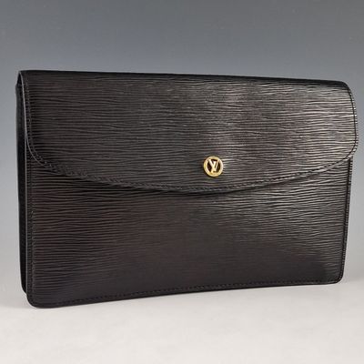 a black louis vuitton clutch bag with gold hardware