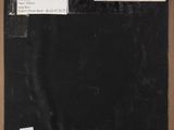 a black and white photograph of a piece of paper with a note attached to it