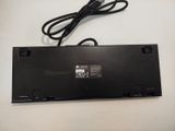 a close up of a laptop battery and a cord on a table