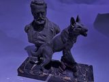 statue représentant un homme et un chien, posée sur un socle en marbre