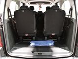 four seats in the back of a van with the door open
