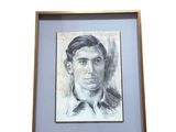 portrait d'un homme en costume-cravate dans un cadre en bois