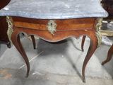 a marble top table with a marble top on it