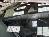 a reflection of a car in the rear window of a car