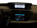 the dashboard of a car with a digital display in the center