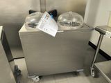 a stainless steel dishwasher in a commercial kitchen
