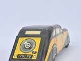 yellow and black toy car with a speaker on top of it