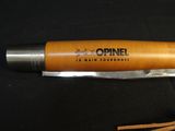 an image of a pen that is on a black surface