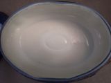 a blue and white bowl sitting on a table