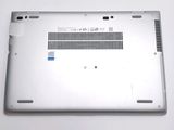 a close up of a silver laptop with a blue sticker on the back of it
