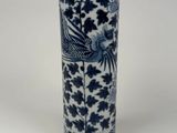 a blue and white vase with a bird design on it