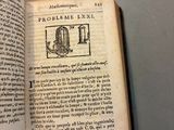 an open book with a picture of a machine on it