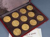 a box of gold coins sitting on top of a table