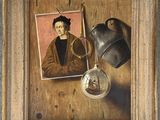 une peinture à l'huile représentant un homme tenant une paire de ciseaux, à côté d'une photo d'un homme portant un chapeau