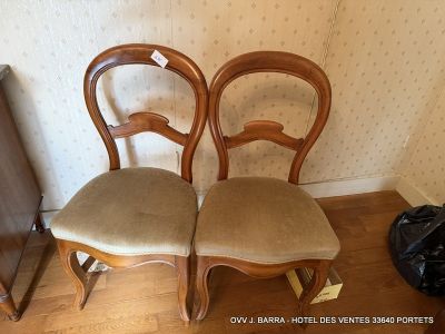 two chairs sitting next to each other in a room
