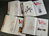 six books with drawings of women and men on them sitting on a table