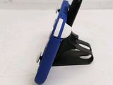 a cell phone holder with a pen on top of it