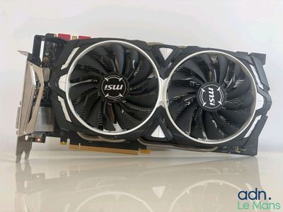 a close up of a video card with a fan on top of it