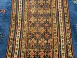 a blue rug with an oriental design on top of it