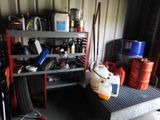 a garage with a lot of items on the shelves